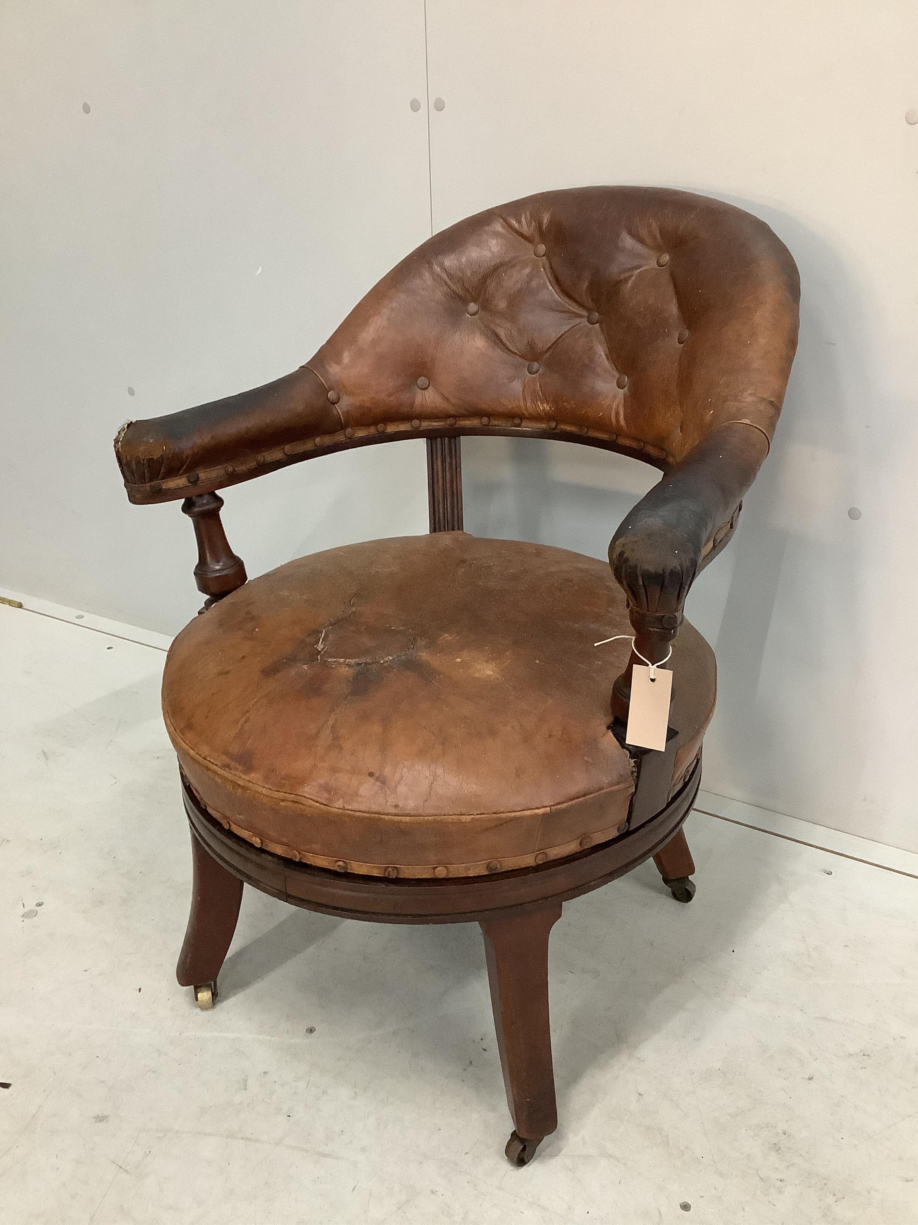 A 19th century Holland & Son leather button back office chair (missing one castor), width 65cm, depth 56cm, height 80cm. Condition - poor